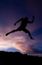 Silhouette happy jumping against beautiful in sunset. Freedom, enjoyment concept Royalty Free Stock Photo