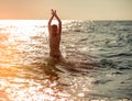 Silhouette of boy jumping in sea Royalty Free Stock Photo