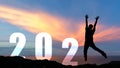 Silhouette happy man raise hands congratulation and celebrate in Happy New year 2021 for change new life future concept Royalty Free Stock Photo