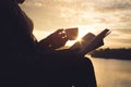 Silhouette of happy old women reading a book