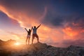 Silhouette of happy people on the mountain