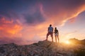 Silhouette of happy people on the mountain against colorful sky Royalty Free Stock Photo