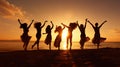 silhouette of happy women friends dancing at beach party at sunset, joyful group of female celebrate on vacation Royalty Free Stock Photo