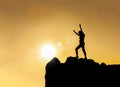 Silhouette - happy young girl on top of mountain Royalty Free Stock Photo