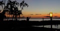Silhouette of a Hawaiian hula dancer at sunset with palm trees on the beach, Lahaina, Maui, Hawaii Royalty Free Stock Photo