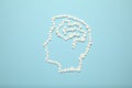 Silhouette of head and brain from medical pills. Headache and cancer treatment Royalty Free Stock Photo