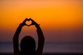 Silhouette of heart made hands at sunset Royalty Free Stock Photo