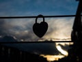 Silhouette of the heart shaped padlock hanging Royalty Free Stock Photo