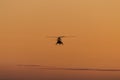 Silhouette of helicopter with sunset sky Royalty Free Stock Photo