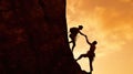 Silhouette of helping hand between two climber. couple hiking help each other silhouette in mountains with sunlight.