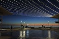 Silhouette of Henley Beach pier and square at dusk