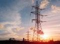 Silhouette High voltage electric tower on sunset time and sky on sunset time background. Royalty Free Stock Photo