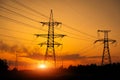 Silhouette High voltage electric towers at sunset time. High-voltage power lines. Electricity distribution station Royalty Free Stock Photo