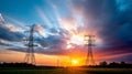 Silhouette of high voltage electrical tower against sunset and beautiful sky. Royalty Free Stock Photo