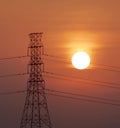 Silhouette of high voltage electricity post with sunset backgro Royalty Free Stock Photo