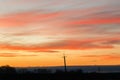 Silhouette of high voltage power lines against the background of dramatic sky at sunset Royalty Free Stock Photo