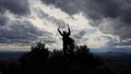 Silhouette of Hiker Celebrating Reaching the Summit