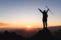 Silhouette of hiker standing on top of hill and enjoying sunrise over the valley.  The man thank God on the mountain and success Royalty Free Stock Photo