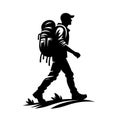 silhouette of a hiker walking along a trail with a backpack