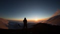 Silhouette hiker watching the golden hour during sunset in the backlight on Etna Volcano -Sicily