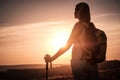 Silhouette hiker woman tracking with backpack