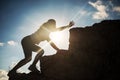 Silhouette hiking woman ask for help to the peak Royalty Free Stock Photo