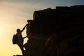 hiking woman climb to top hill at sunset Royalty Free Stock Photo