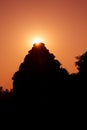 Silhouette of an Hindu temple as the sun rays emerge from behind. Sun Temple, Konark, Odissha (Orissa), India. UNESCO