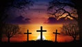 Silhouette of 3 holy crosses on beautiful orange sunset