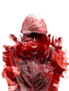 Silhouette of a hooded man, isolated on black background. Creative. Effect of Double exposure. Silhouette Isolate