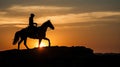 Silhouette of a horse rider on a cliff at sunset Royalty Free Stock Photo