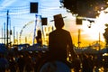 Silhouette of Horse rider at sunset. Seville`s April Fair. Royalty Free Stock Photo