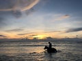 Silhouette of a horse with a rider on it in water at sunset Royalty Free Stock Photo