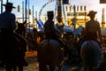 Silhouette of Horse riders at sunset. Seville`s April Fair. Royalty Free Stock Photo