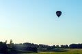 Silhouette hot air balloon in blue sky landscape background.Hot air balloon over the green field Royalty Free Stock Photo