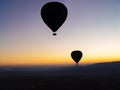 Silhouette of hot air balloons flying over the Cappadocia valley