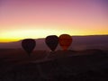 Silhouette of hot air balloons flying over the Cappadocia valley