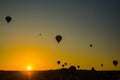 Silhouette of hot air balloons flying over the valley at Cappadocia, Anatolia, Turkey. Volcanic mountains in Goreme