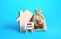 Silhouette of a house with a money bag and FHA loan easel. Mortgage insured by Federal Housing Administration Loan. Affordable