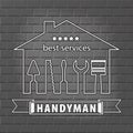 Silhouette of a house with tools for repair. Handyman logo on brick wall background in grey. Royalty Free Stock Photo