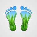 Silhouette of human footprints with grass inside