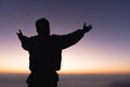 Silhouette of a human hand opens its palm to worship. the sun is rising concept of christianity Fight and win for God. Human Royalty Free Stock Photo