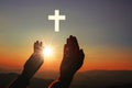 Silhouette of human hands palm up praying and worship of cross, eucharist therapy bless god helping, belief, forgiveness, freedom Royalty Free Stock Photo