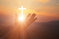 Silhouette of human hands palm up praying and worship of cross, eucharist therapy bless god helping, belief, forgiveness, freedom Royalty Free Stock Photo