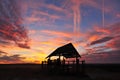 Silhouette hut at sunset.