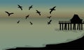 Silhouette of huts and bird at the beach Royalty Free Stock Photo