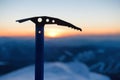 Silhouette of iceaxe against sunset Royalty Free Stock Photo