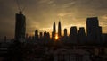 A silhouette image of a buildings upon sunrise