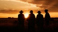 Silhouette image of a group of farmers standing together in a field at sunset