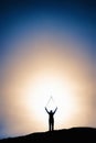 Silhouette image of man with hands raised at a height Royalty Free Stock Photo